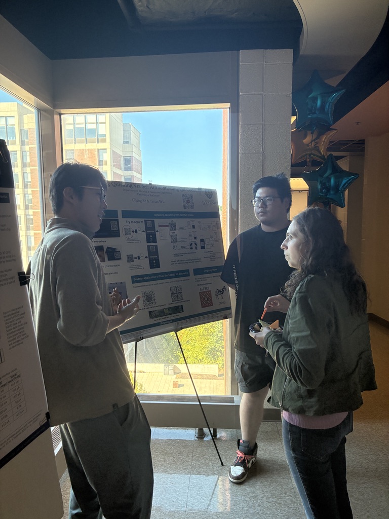 Yicun Wu and Cheng Ke presenting a DMQR poster at the ECE Open House during Meliora Weekend